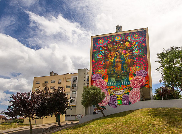 Graffiti op flat in wijk Marvila, Lissabon